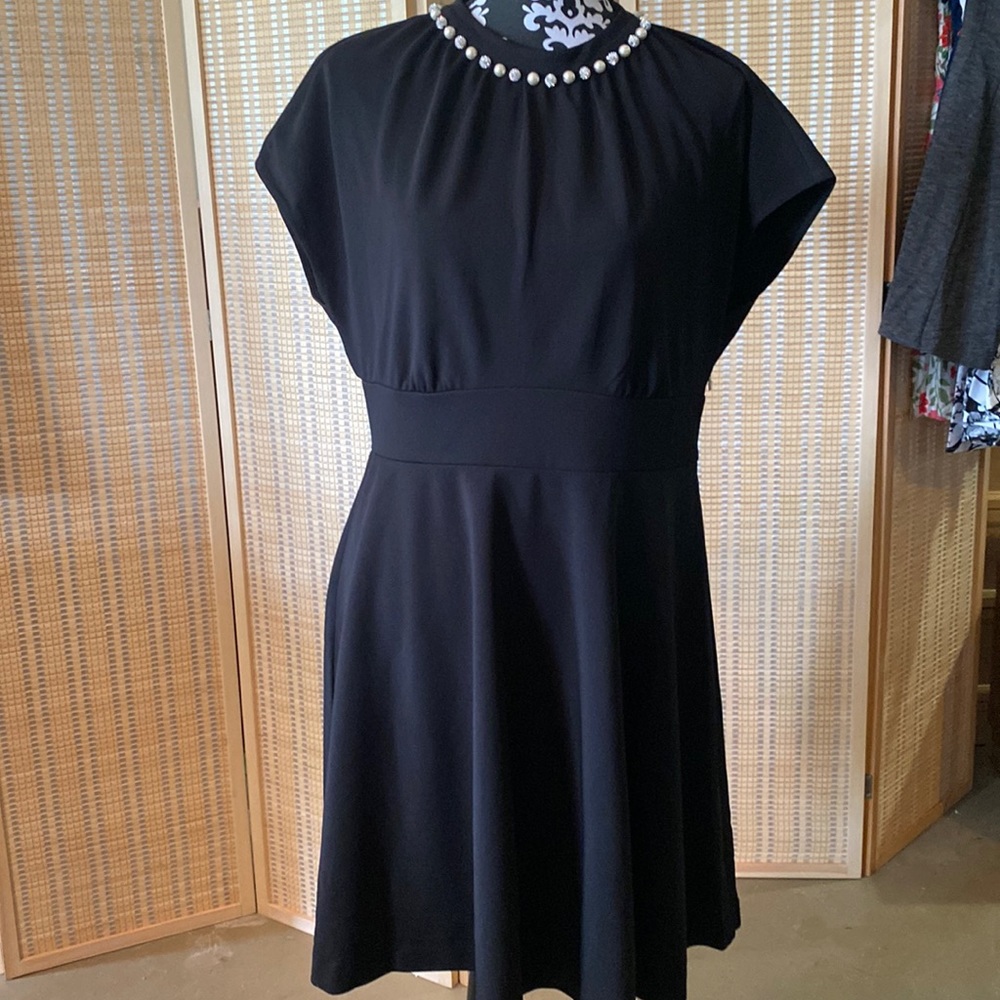 Black dress neck line pearls